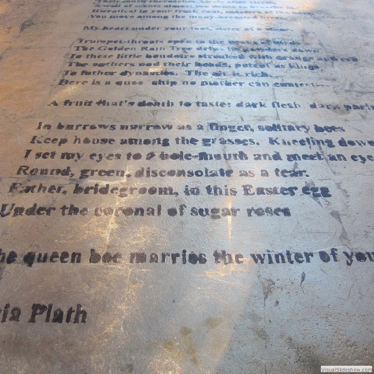 Sylvia Plath's poem 'The Beekeeper's Daughter' is gold leafed onto the cast concrete table.